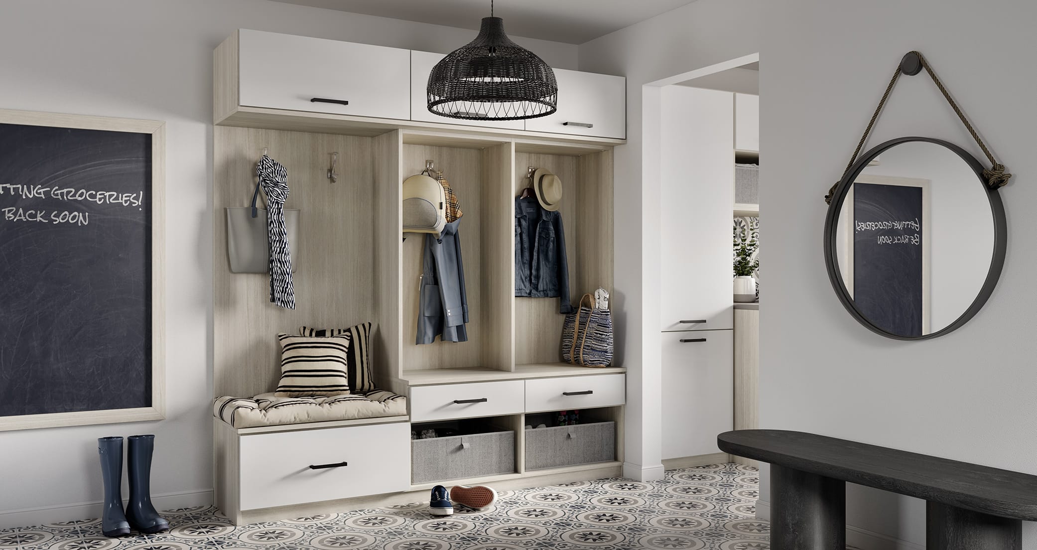 Mudroom entyway with open shelving, custom cabinets, bench and chalkboard created by California Closets