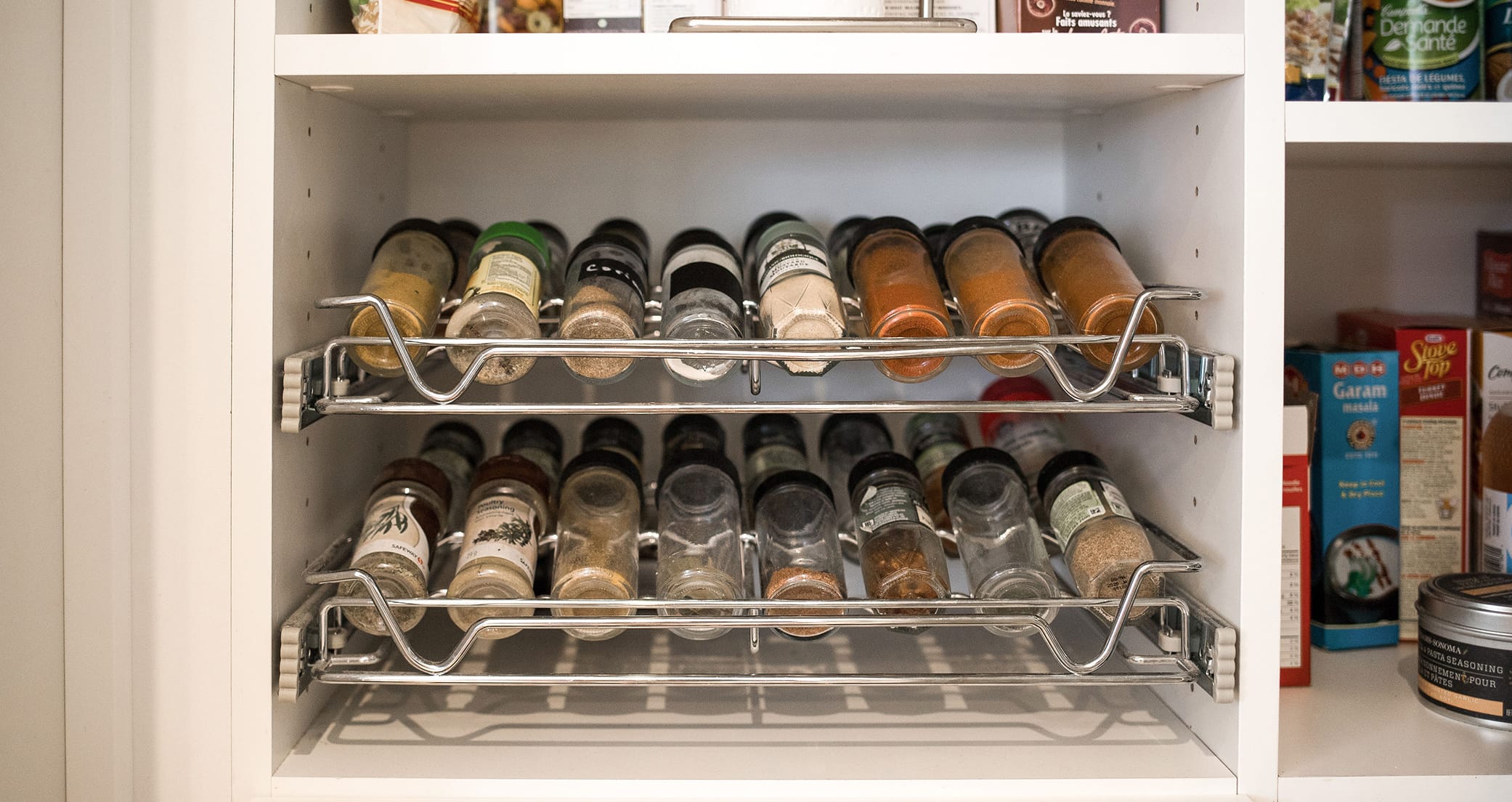 Kitchen wire rack pullout spice drawer storage by California Closets