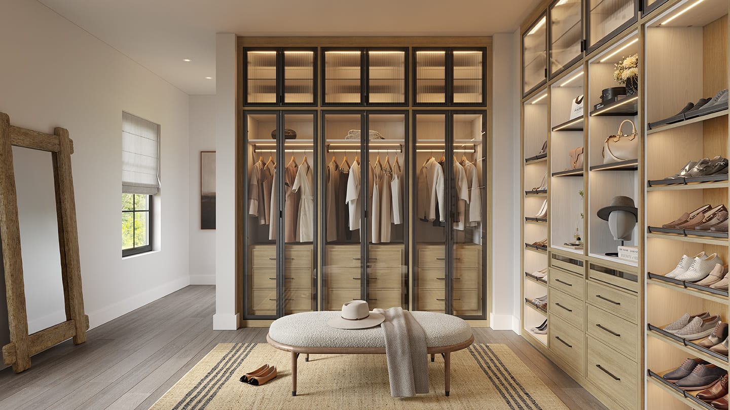 Specialty lighting with custom drawers and natural wood finish by California Closets