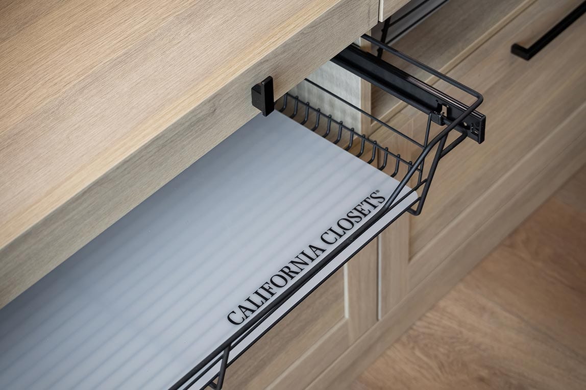 Kitchen pantry pull out wire baskets in a light finish by California Closets